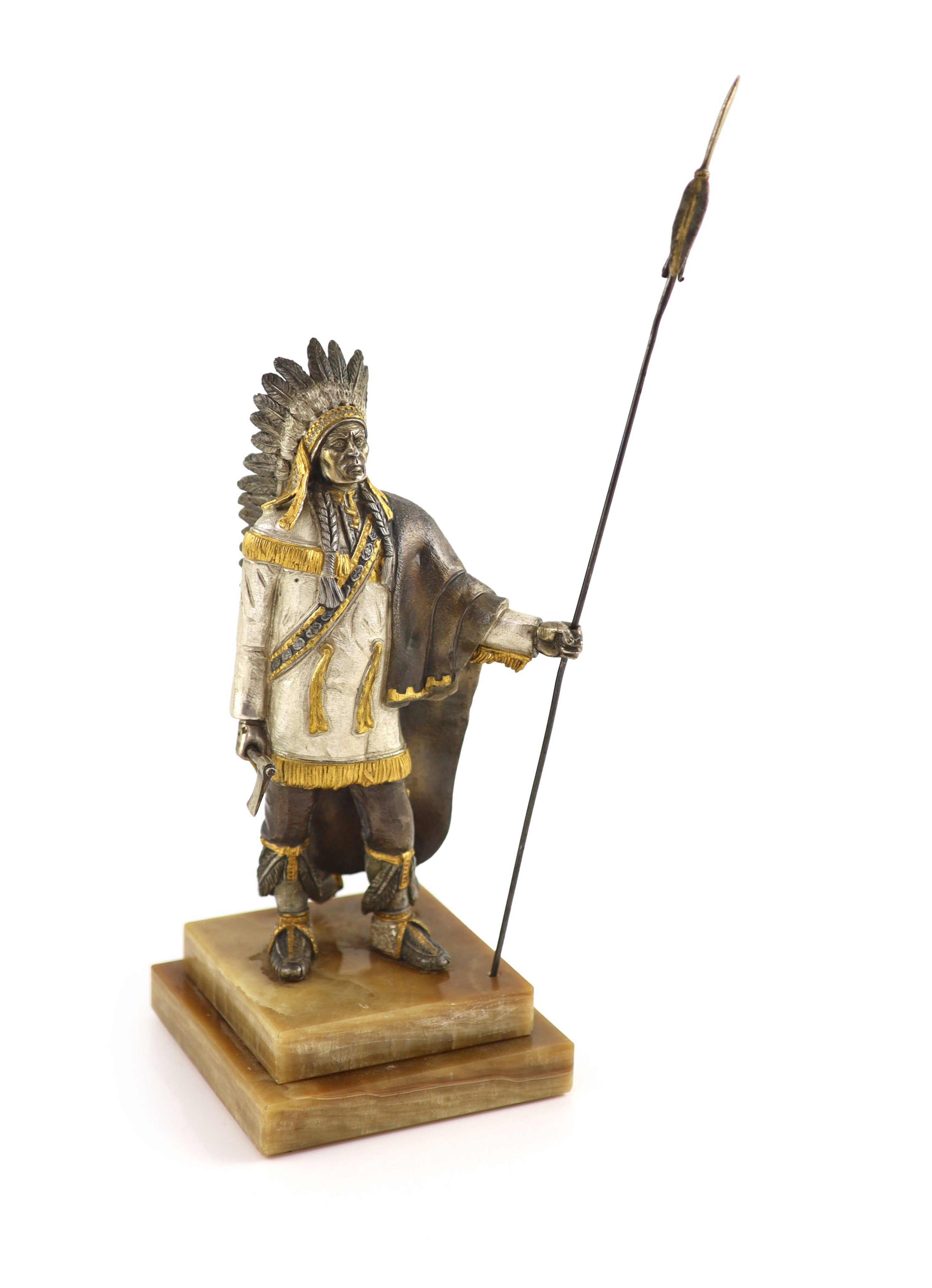 After Carl Kauba, a gilded, silvered and patinated bronze figure of a Native American chieftain, H 36 cm. (from tip of spear)